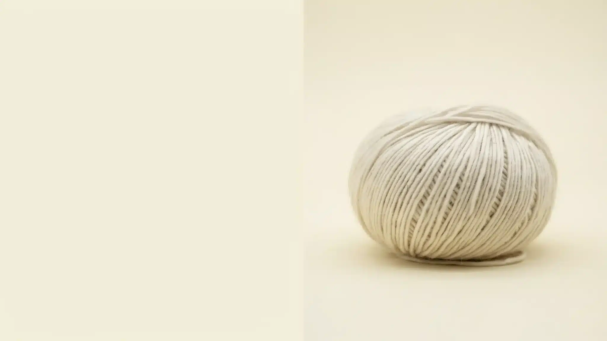Soft Angora fabric color swatch, showcasing pale yellow-beige for 2026 trends.