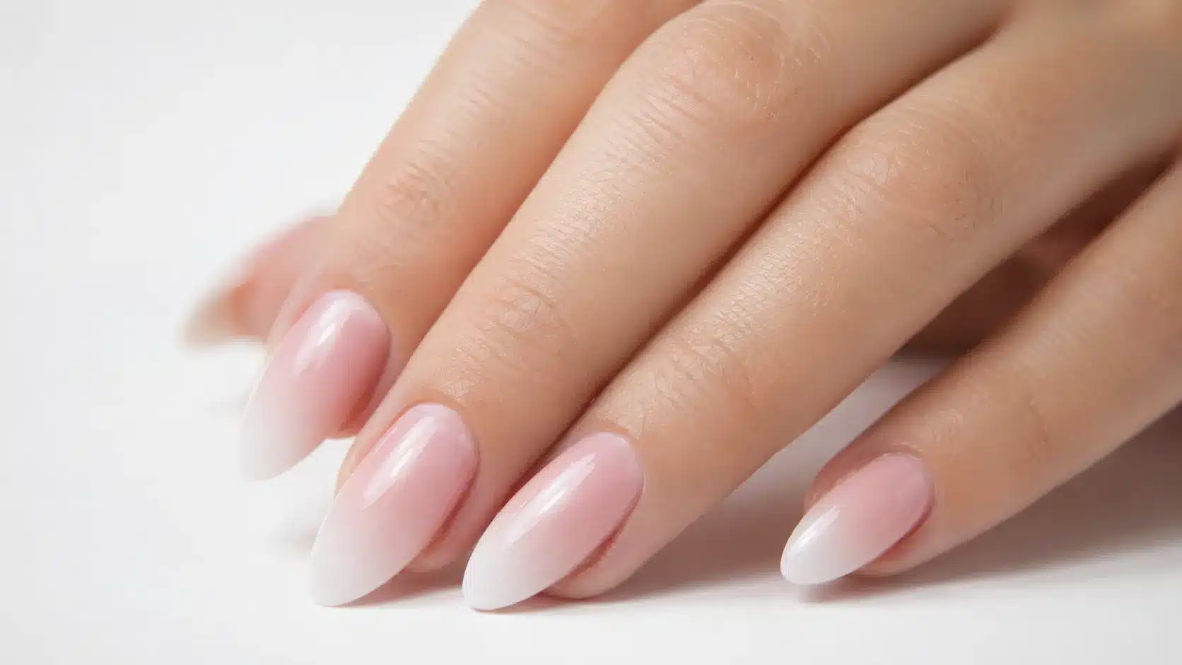 Classic pink and white ombre nails with a glossy finish