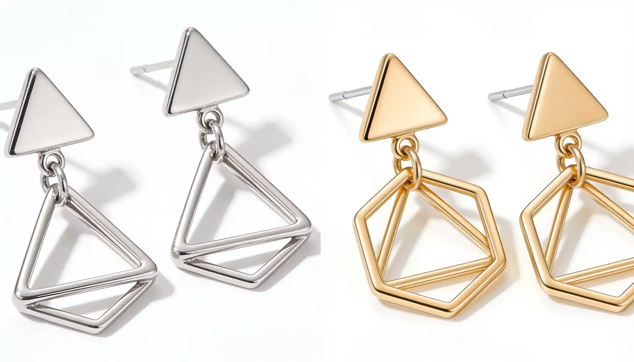 Silver and gold geometric triangle drop earrings with open triangular shapes.