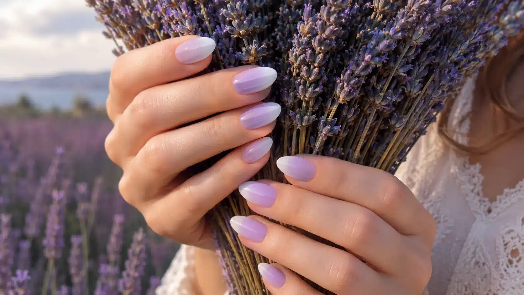 Lavender ombre nails fading into soft white