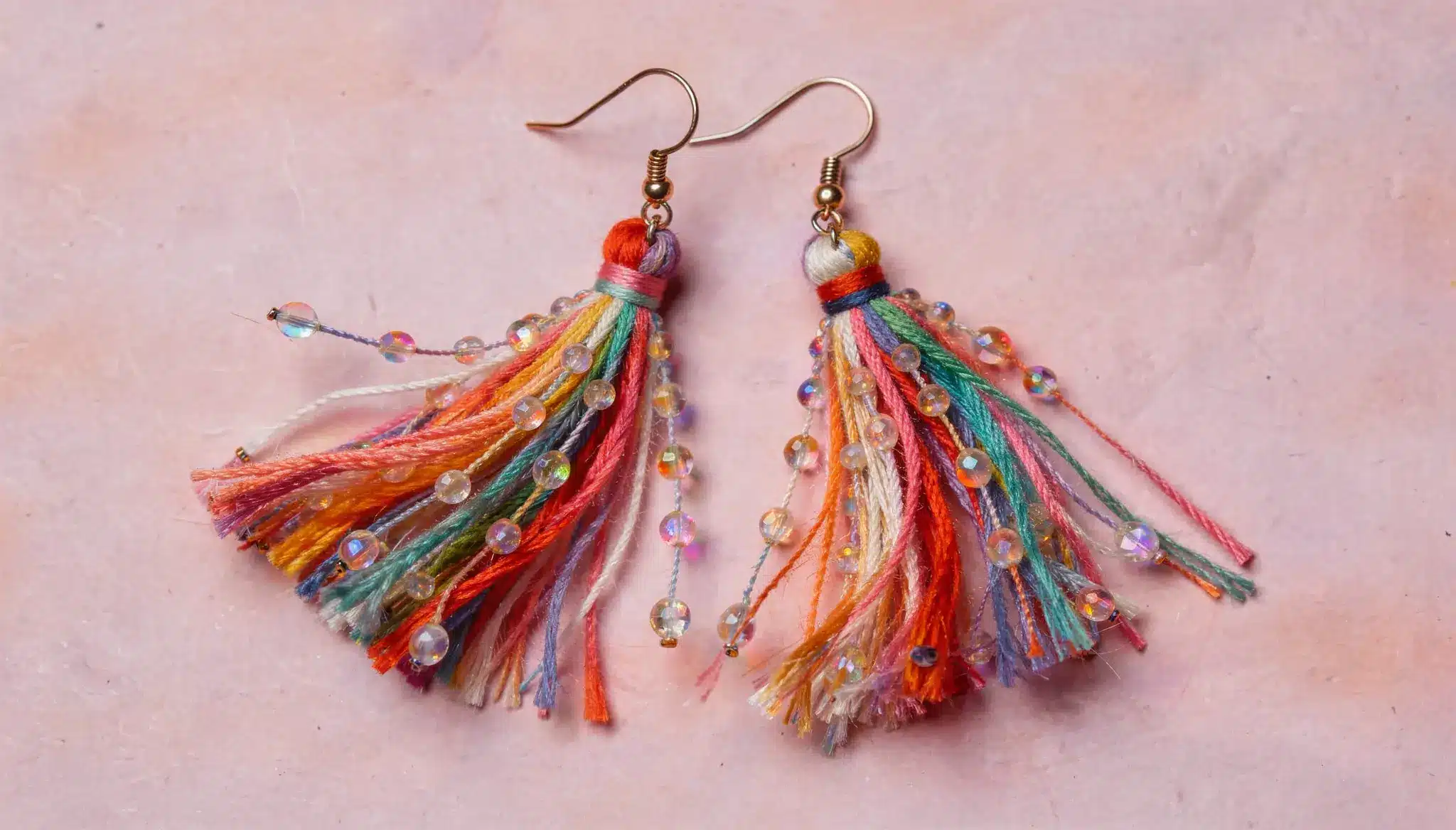 Colorful tassel earrings with beads and threads, playful and lightweight