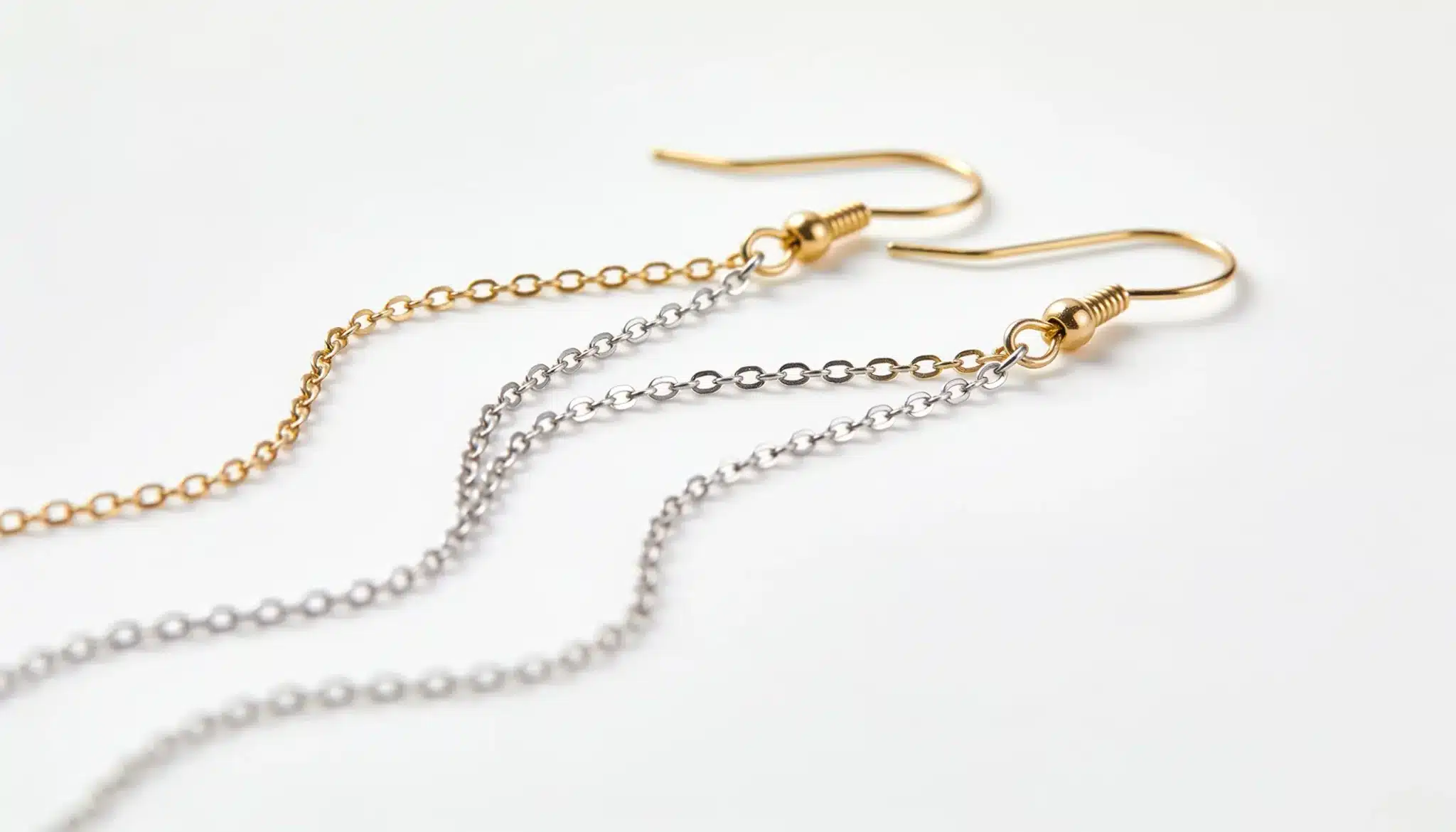 Gold and silver chain threader earrings with minimalist design.