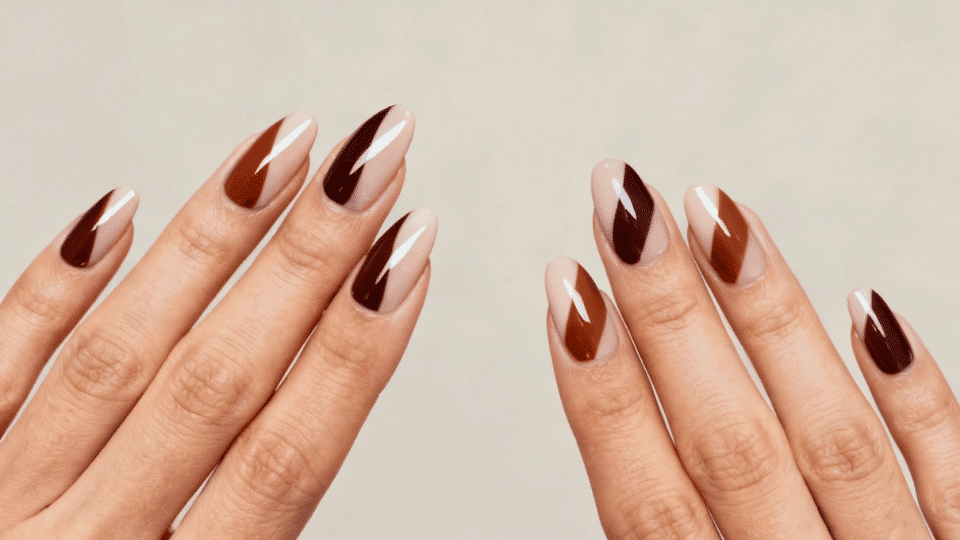Almond nails with two-tone colors split diagonally or horizontally, modern polished manicure.
