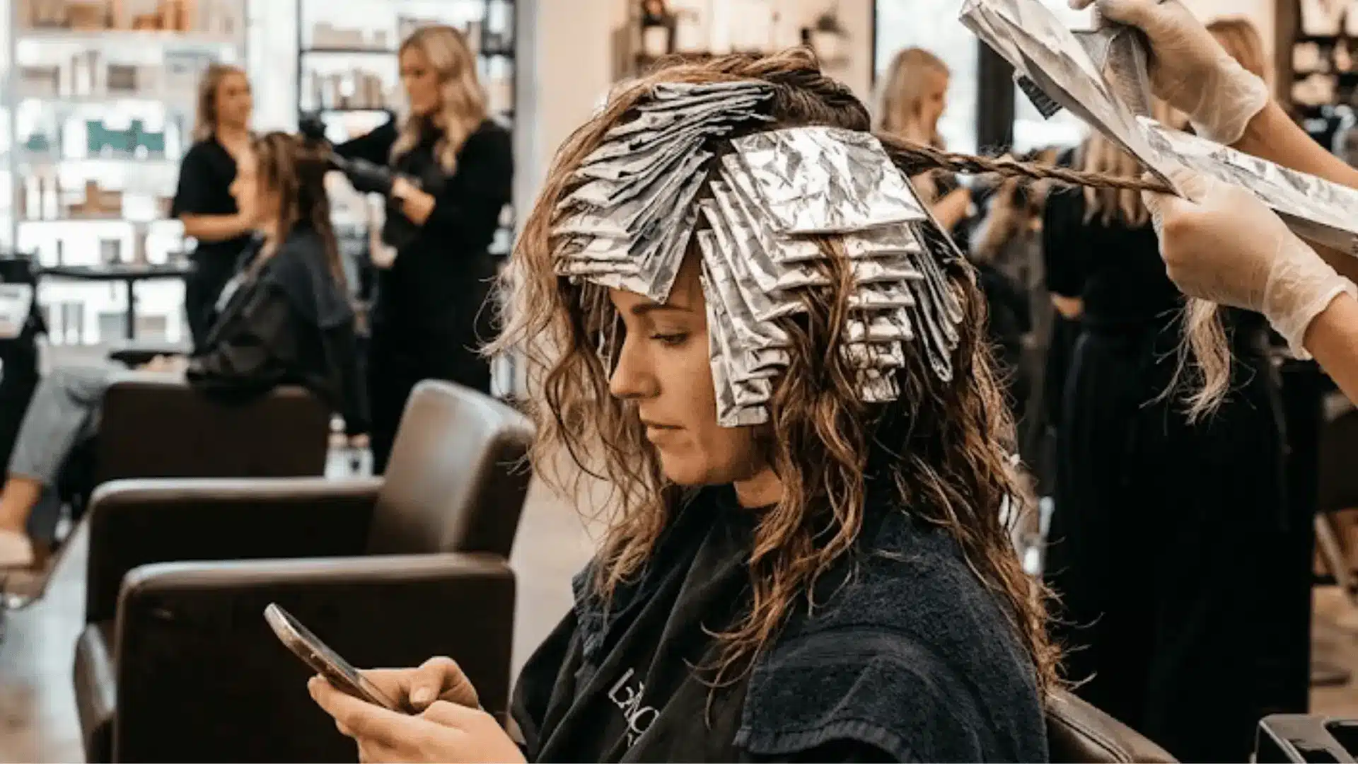 Traditional hair highlights applied with foil sections throughout the hair.